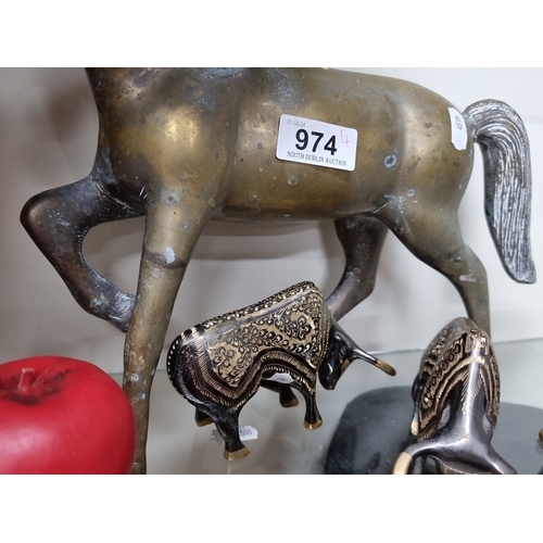 974 - One brass horse, two ornate bulls, and one patterned rabbit decorative metal figurines.