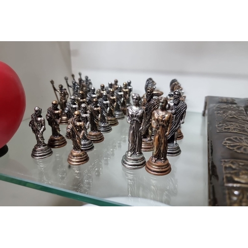 976 - A complete 32 piece Bronze Roman-themed chess set with ornate bronze-board. Intricately detailed pie... 