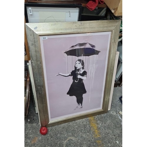 894 - A large print of an iconic Banksy mural titled 'Nola'. Housed in a gilt frame behind glass. 
MM: 75 ... 