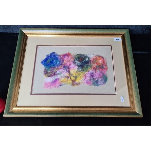 914 - A vibrant needle felt wool artwork mounted on linen. Housed in a green gilt frame behind glass. With... 