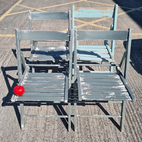 761 - A set of four quality wooden garden chairs in a teal blue finish.