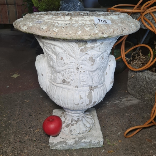 768 - A large reconstituted stone urn shaped planter.