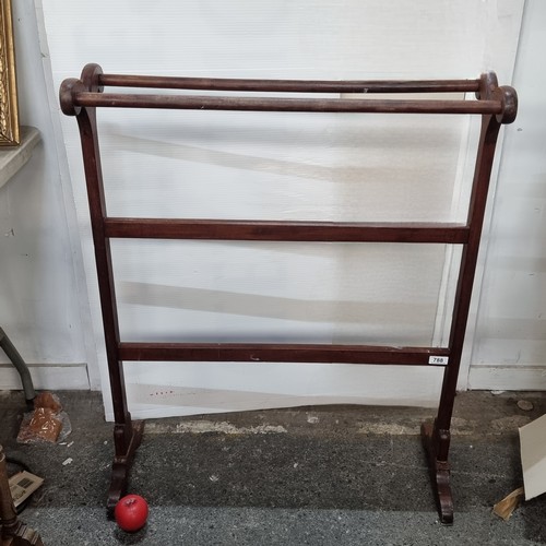 788 - A handsome 19th century  towel rack with four rails. Features nice patina and a lovely shape.