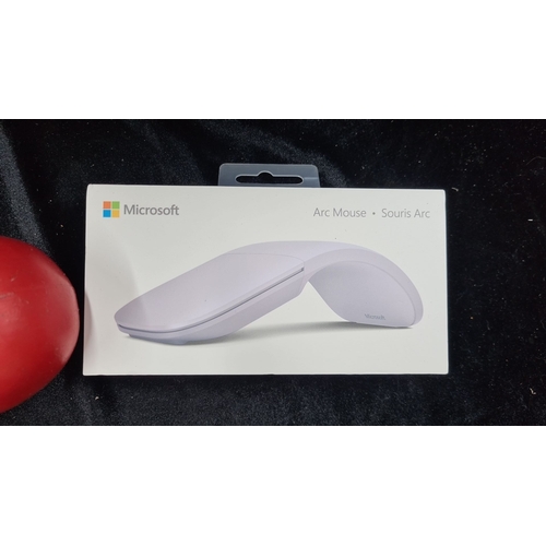 937 - A Microsoft Arc Mouse. Ultra-portable, Bluetooth 4.0 compatible, touch-scroll surface, folds to turn... 