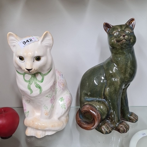 942 - A pair of ceramic cat figurines. One is hand-painted with floral details. Both have a 'Made in Wales... 