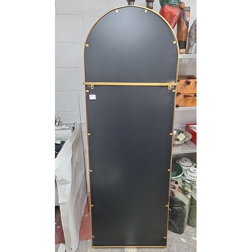 982 - Star LoT : A brand new very large full length arched mirror with a gold-tone metal frame, featuring ... 