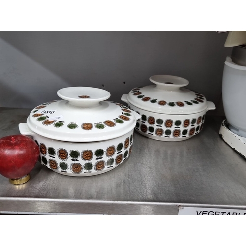 1000 - A pair of Arklow Ceramics casseroles with lids, featuring tree motifs in green and brown. Produced i... 