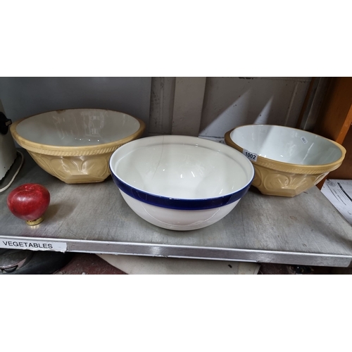 1002 - Three vintage mixing bowls. Includes two T.G. Green & Co. Gripstand bowls and one white bowl with a ... 