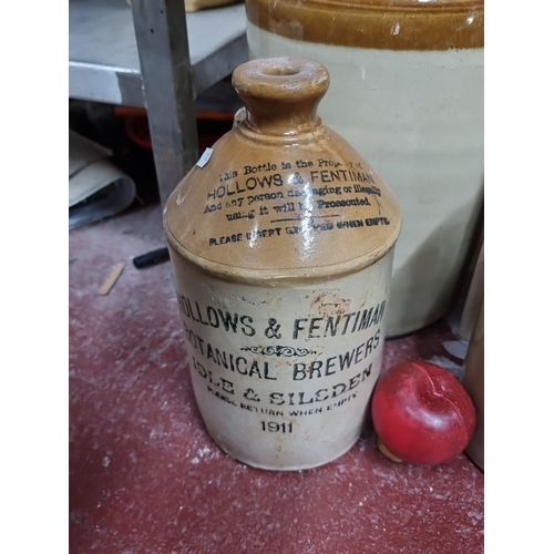 1011 - An assortment vintage stoneware bottles and jugs, including a 1911 Hollows & Fentiman botanical brew... 