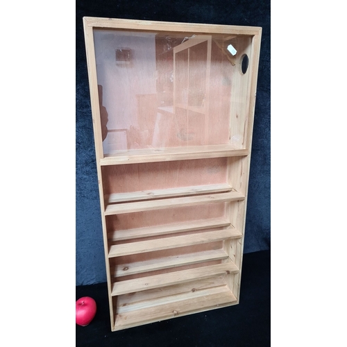 1012 - A Wooden display case with five shelves and glass front cover. Includes rear hanging hardware. Dimen... 