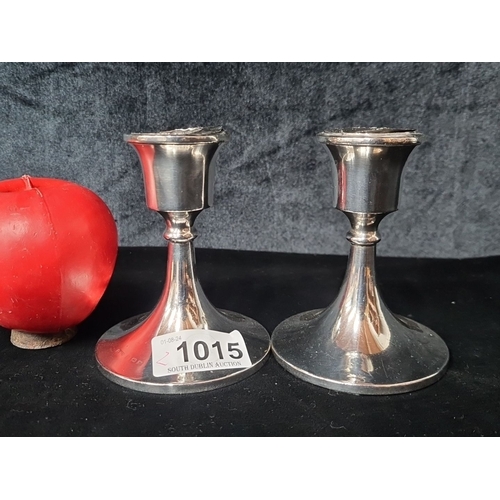 1015 - Pair of Sterling silver candlestick holders, with flared bases and minimalist design. Hallmarks for ... 