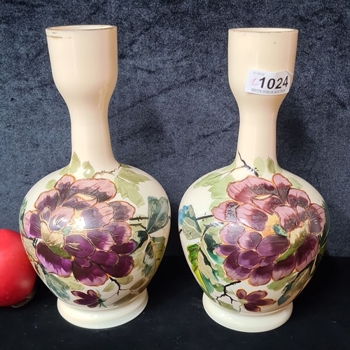 1024 - Two hand-painted milk glass vases adorned with vibrant floral motifs and gilded accents. The intrica... 