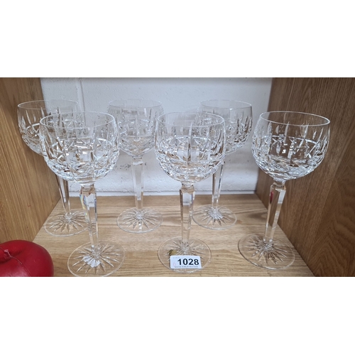 1028 - A set of six tall Waterford crystal stemmed glasses. All in good condition with acid marks to base.