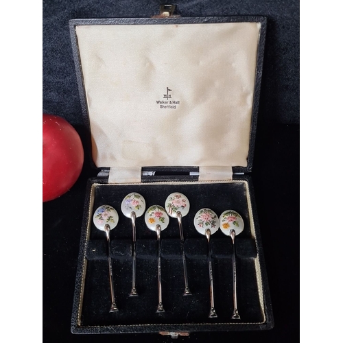 1029 - A hallmarked Walker & Hall Sheffield sterling silver six-piece set of demitasse spoons with floral e... 