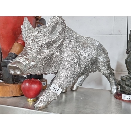 987 - A silver-toned wild boar statue, intricately detailed, measuring approximately 18 inches in length.