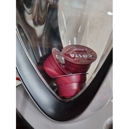 993 - A DeLonghi Nescafé Dolce Gusto Coffee Machine. Comes with Costa coffee pods. The machine has a sleek... 