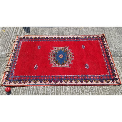 843 - A lovely retro style wool rug with beautiful burnt orange tones along with blues, reds and purples
1... 