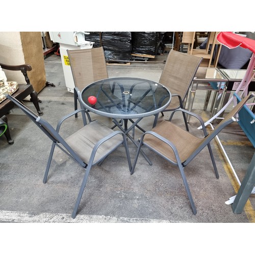 817 - Star Lot : A sleek garden patio set with round glass topped table ( also slot for umbrella ) along w... 