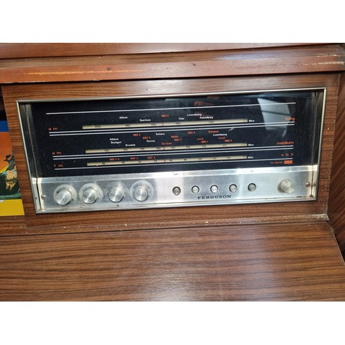 823 - A very cool 1960s vintage radiogram  music centre with concealed Garrard 2025 TC turntable along wit... 