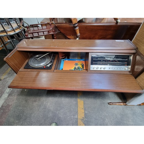 823 - A very cool 1960s vintage radiogram  music centre with concealed Garrard 2025 TC turntable along wit... 