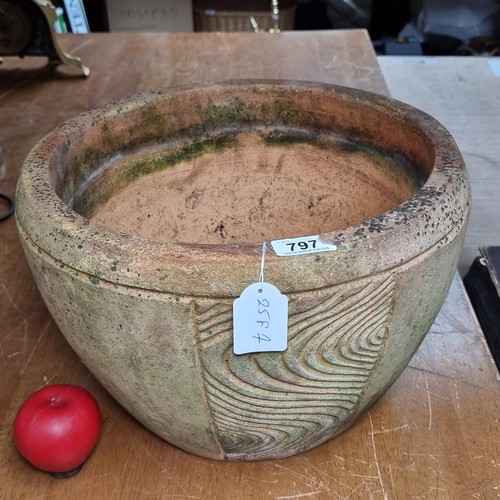 797 - A nice example of a large terracotta planter with engravings.