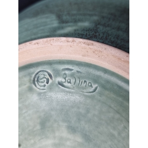 999 - A beautiful green stoneware bowl with intricate interior pattern, stamped 