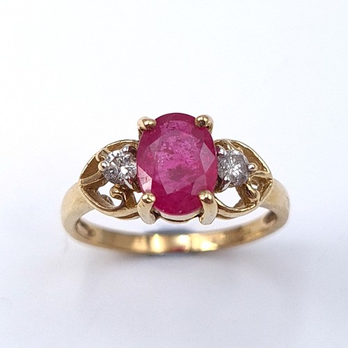 7 - Star Lot : A very attractive diamond and large Burmese ruby set ring mounted in nine carat gold. Wei... 