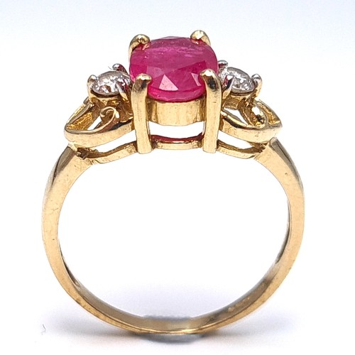 7 - Star Lot : A very attractive diamond and large Burmese ruby set ring mounted in nine carat gold. Wei... 