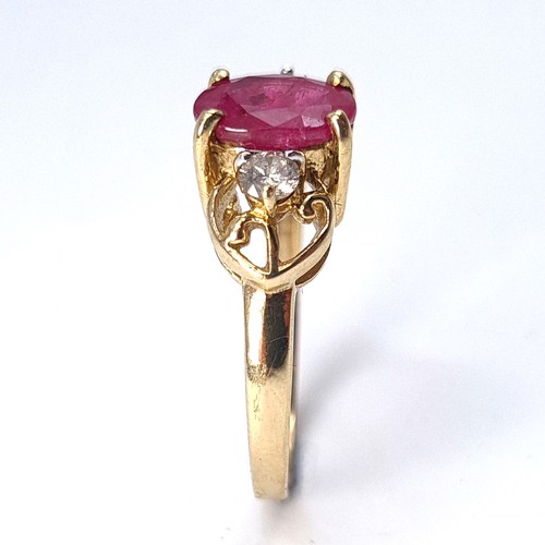 7 - Star Lot : A very attractive diamond and large Burmese ruby set ring mounted in nine carat gold. Wei... 