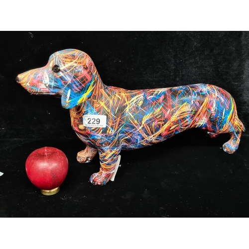 229 - A funky Interior design colourful figure in the form of a Dachshund dog. From a Uk Home design compa... 