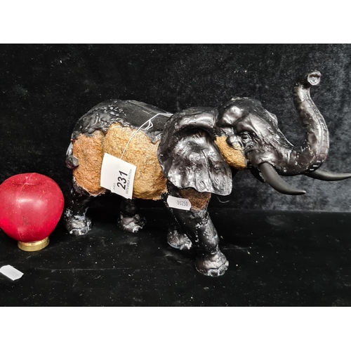 231 - A delightful brand new Hone decor model of an elephant with its trunk up. From a Uk Home design comp... 