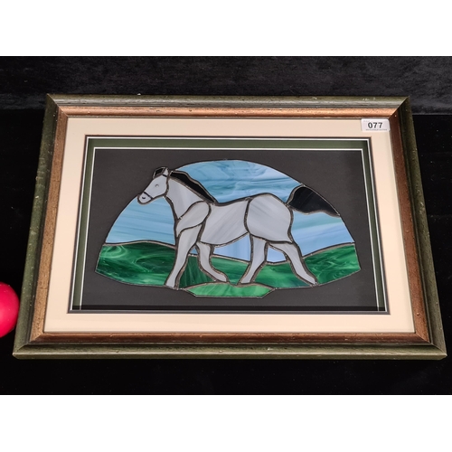 77 - A fabulous framed stained glass artwork featuring a galloping horse. Housed in a shadow box frame be... 