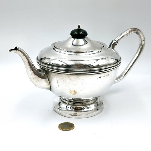 16 - Star Lot : A nice example of a solid Sterling Silver  tea pot hallmarked Birmingham 1931 set with an... 