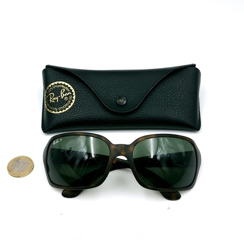 18 - A pair of Ray-Ban sunglasses marked 'Made in Italy' with faux tortoise shell frames. Lenses in clean... 