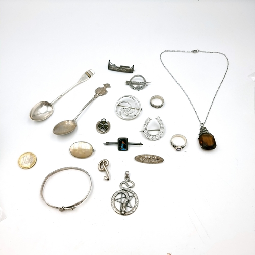 28 - A fabulous collection of mixed silver items consisting of two teaspoons, a bracelet, two rings (one ... 