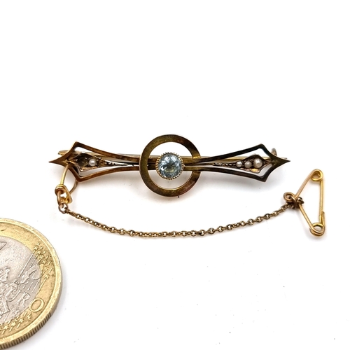 45 - A pretty nine carat gold brooch set with an aquamarine stone together with seed pearl mounts (Two pe... 