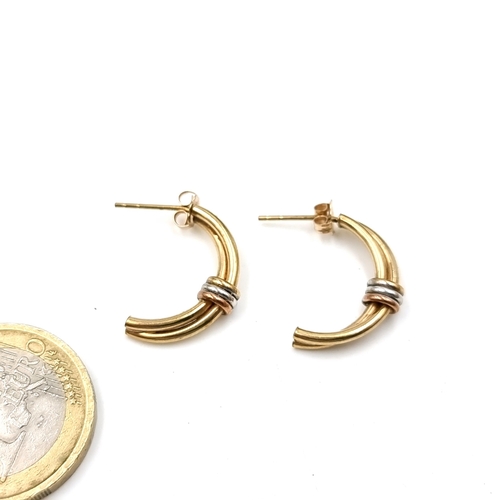 49 - A pair of nine carat gold (375) half hoop stud earrings. Total weight - 1.37 grams.