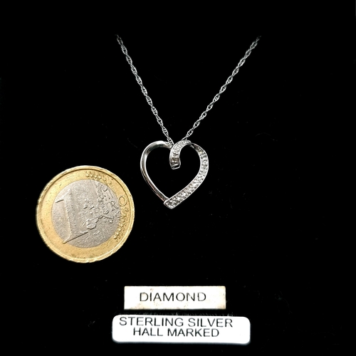 50 - A very attractive heart shaped diamond set pendant necklace with silver chain. Length of chain - 44 ... 