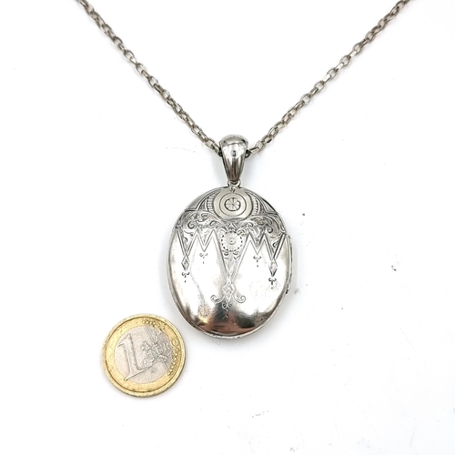 54 - An antique sterling silver locket & chain hallmarked Birmingham. Dimension - 6 x 3 cms. Set with fol... 