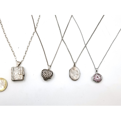 55 - Four sterling silver lockets with chain. One a hot diamond example. Length of chains - 2 x 44 cms, 2... 