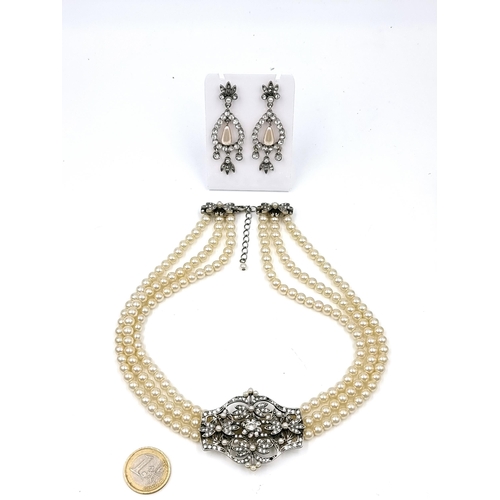 58 - A suite of jewellery consisting of a three row choker style necklace set with gemstone & pearl setti... 