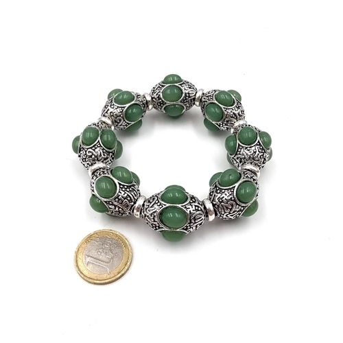 8 - A nice example of a vintage silver bracelet with inlaid cabochon jadeite stones. Weight of bracelet ... 