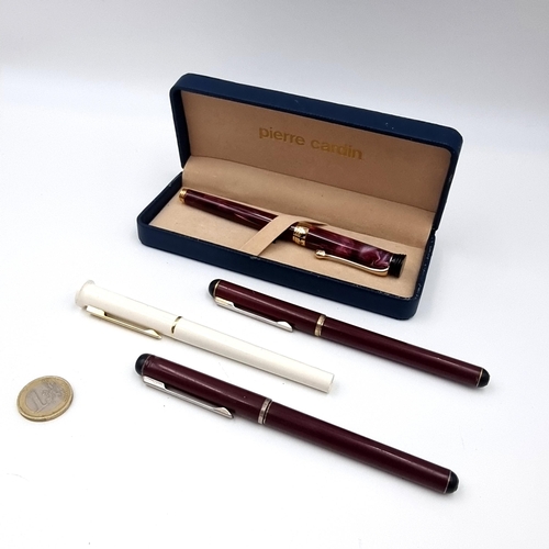 9 - A collection of four Pierre Cardin items consisting if three fountain pens & a ballpoint example. Al... 