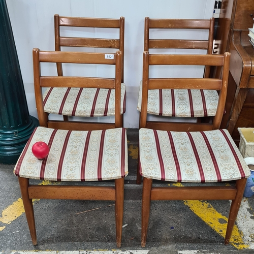 852 - A lovely set of four vintage mid century dining chairs with upholstered seats and tapered legs.