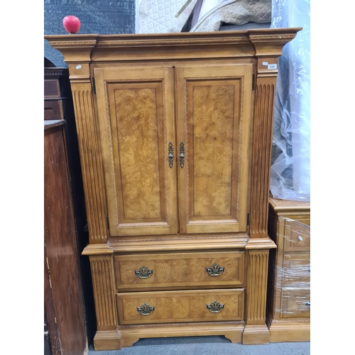 889 - A sleek large Bedroom Armoire entertainment cabinet. Features a two door and two drawer to base ward... 