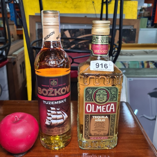 916 - Two sealed bottles of alcohol including a 700ml bottle Olmeca Tequila.