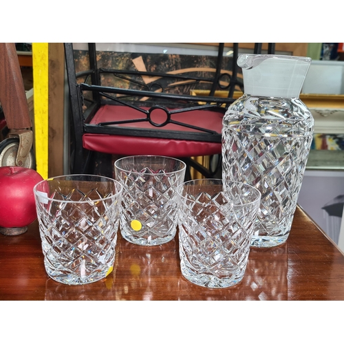 918 - A selection of four Waterford crystal items including three Waterford tumblers in the Tyrone pattern... 