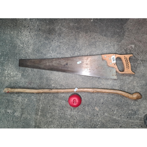 925 - Two vintage items including a hand saw and a carved walking stick.