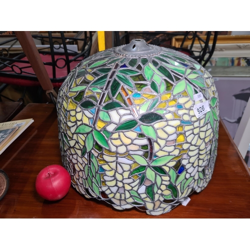 926 - A beautiful large stained glass lamp shade in a floral design featuring green, yellow, and blue glas... 