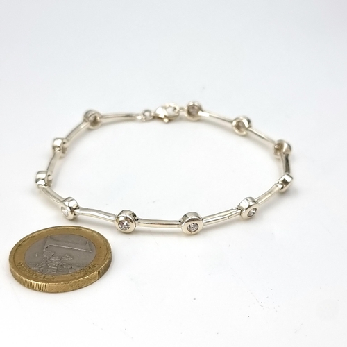 971 - A very pretty Sterling Silver Cocktail bracelet. Features diamantes and lobster clasps.
Total weight... 